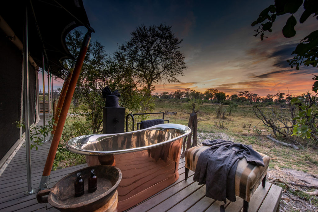 Botswana - Okavango Delta - 1553 - Gomoti Private Camp Bath with a view of sunset