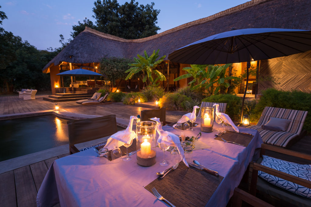 Zambia - South Luangwa National Park - 1564 - Candle Light evening on the decking