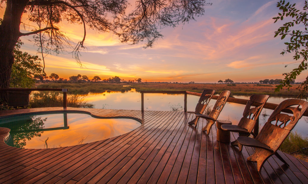 Botswana - Kwando River - Kwando Lagoon - Sunset by plunge pool and decking