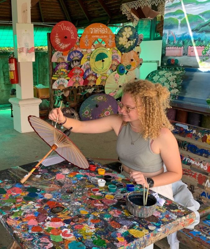 Lady painting and umbrella in Thailand