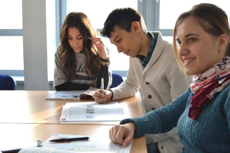 Students sat at table learning