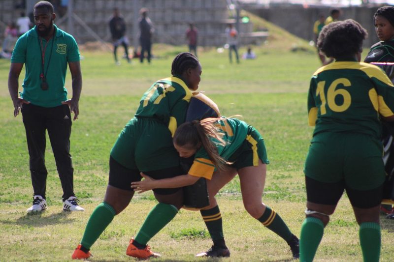 Two young South Africa rugby players rucking