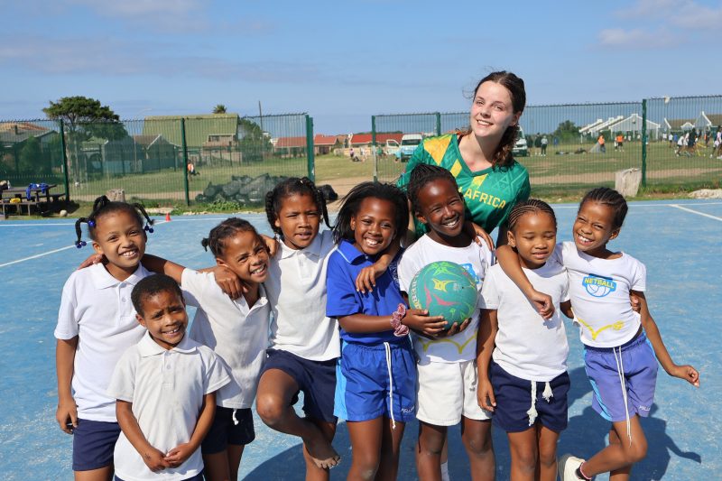 International volunteers leading a netball session during a sports coaching placement in South Africa.