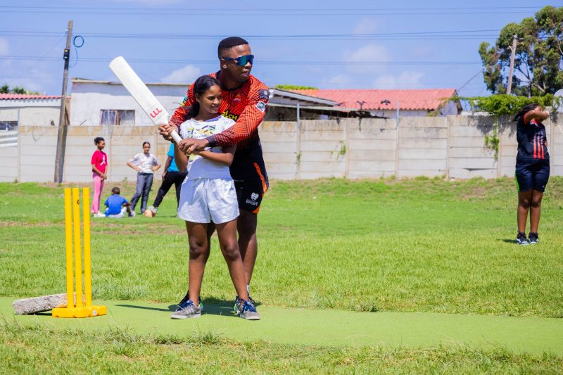 South Africa Sunrisers cricket team coach with international volunteers